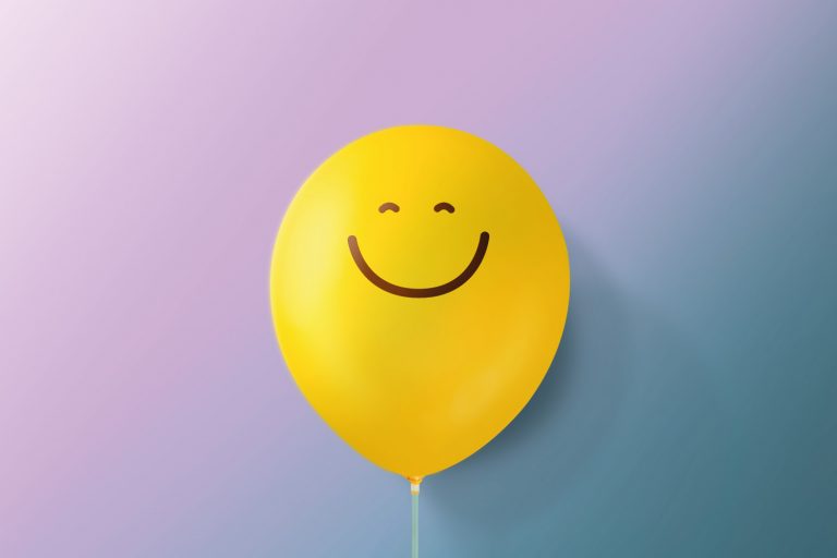 Smiling yellow balloon